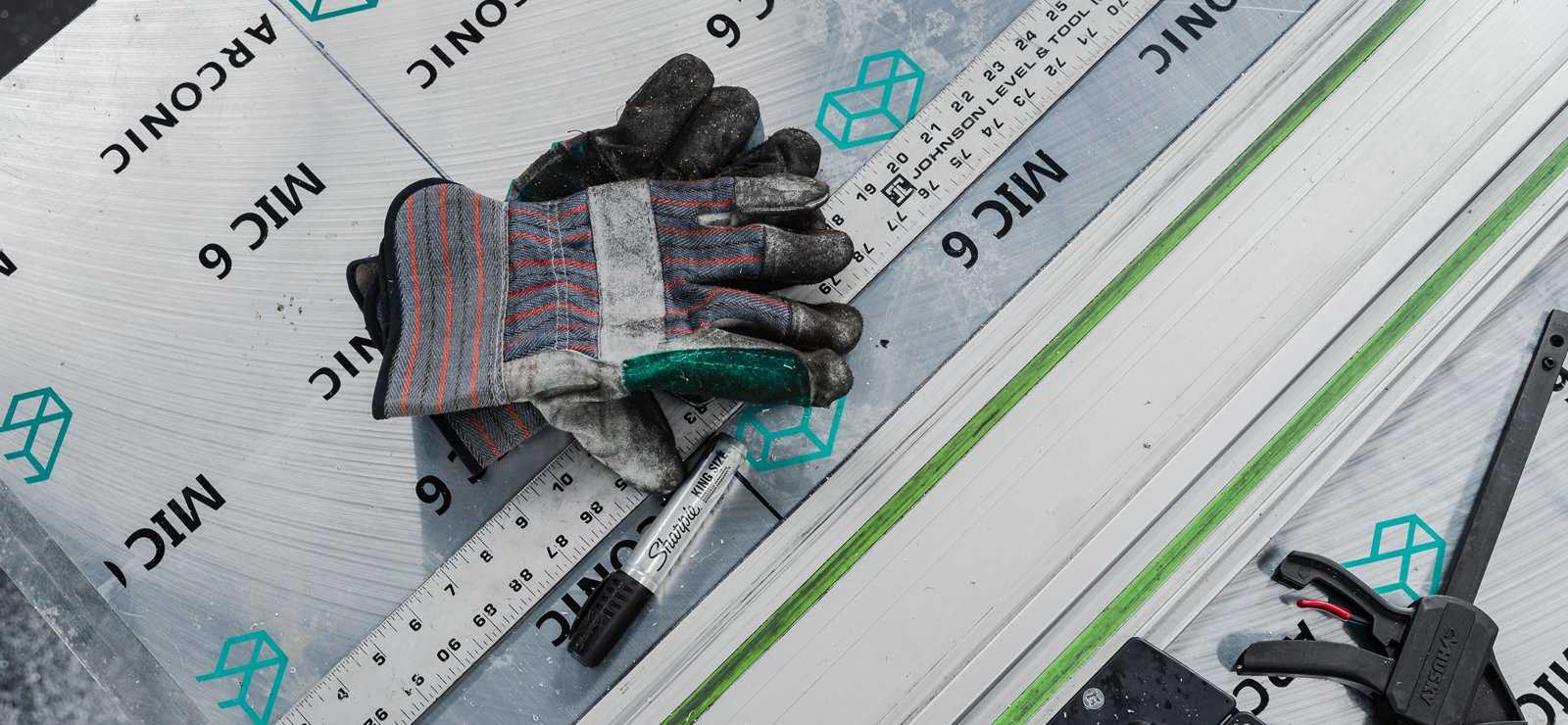 Gloves and Ruler in a transparent table with a formula background