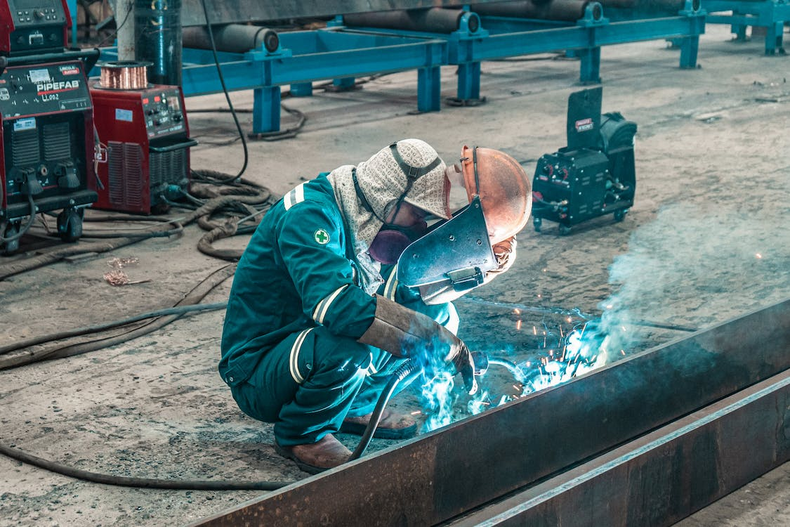 man wearing protective gear working in the workshop