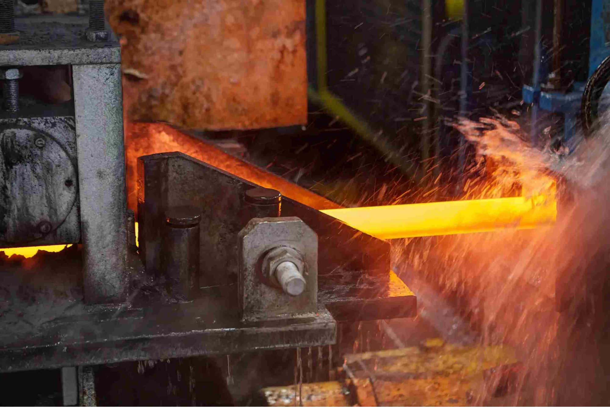 glowing metal rod under machinery